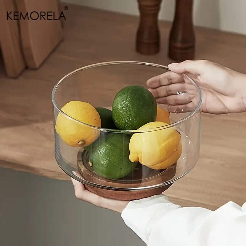 Clear glass fruit bowl with wooden base holding yellow lemons and green limes for decorbites creative glass dining room use