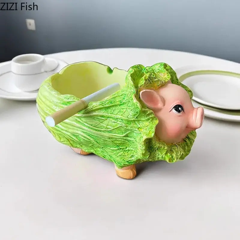 A charming green ceramic decorbites cabbage pig ashtray with pink details and orange feet for living room incense burning
