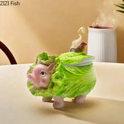 Creative green and pink cabbage pig ashtray made of ceramic with detailed leaf textures and a bird, decorbites cabbage pig
