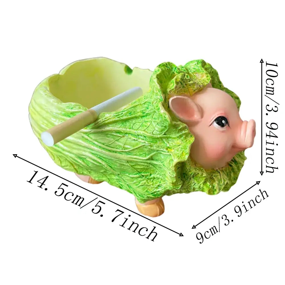 A creative green and pink decorbites cabbage pig ashtray with detailed leaf texture and wooden legs for living room use
