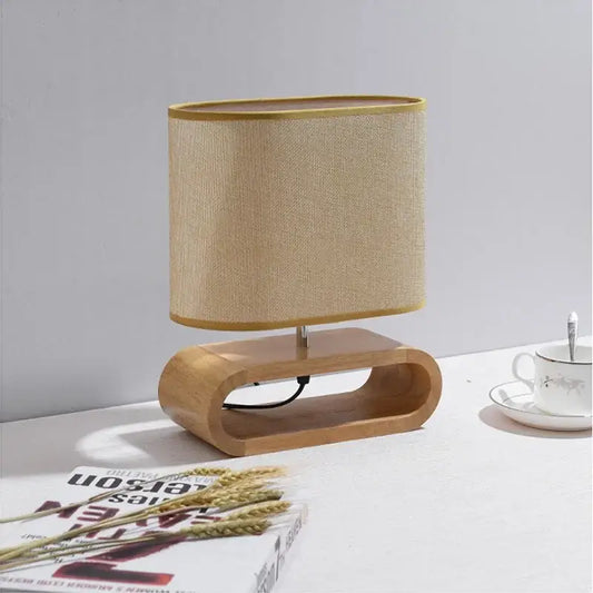 Beige linen lampshade with gold trim on a creative nordic wooden table lamp for bedroom decorbites creative nordic