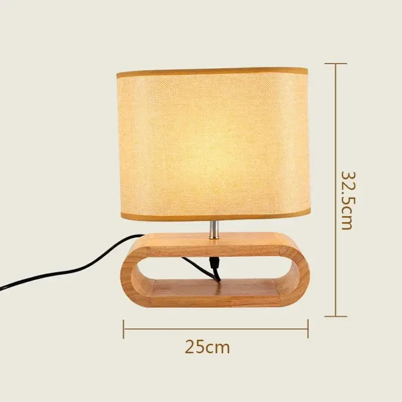 A warm-toned beige linen creative nordic wooden table lamp with an oval cutout light wood base for bedroom decorbites creative nordic