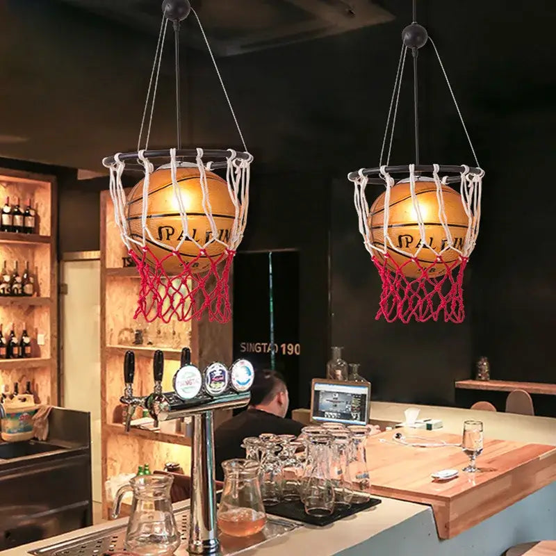 Creative orange basketball pendant light featuring golden spalding basketballs in red netting for decorbites basketball pendant decor