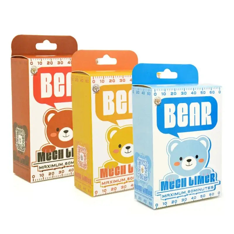 Three colorful bear kitchen timers with cartoon faces in cardboard packaging ideal for kitchen baking tools