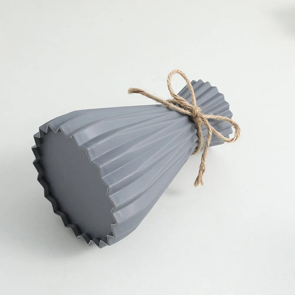 Gray ribbed ceramic flower bottle tied with natural twine in modern european pleated dry flower bottle design