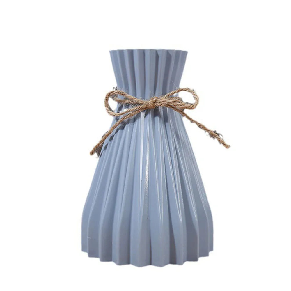 Light blue pleated ceramic flower bottle type adorned with rustic twine bow for dry flower bottle use