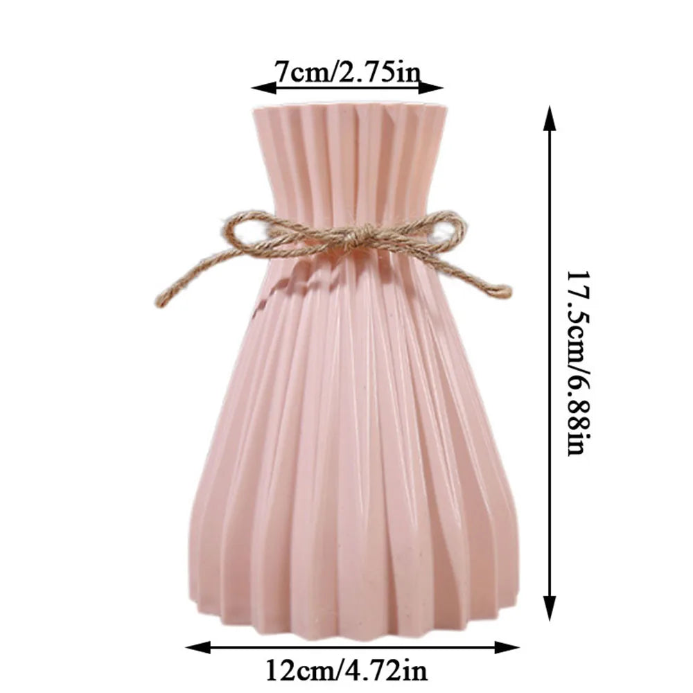 A delicate pink pleated ceramic flower bottle with rustic twine bow, ideal as a dry flower bottle type
