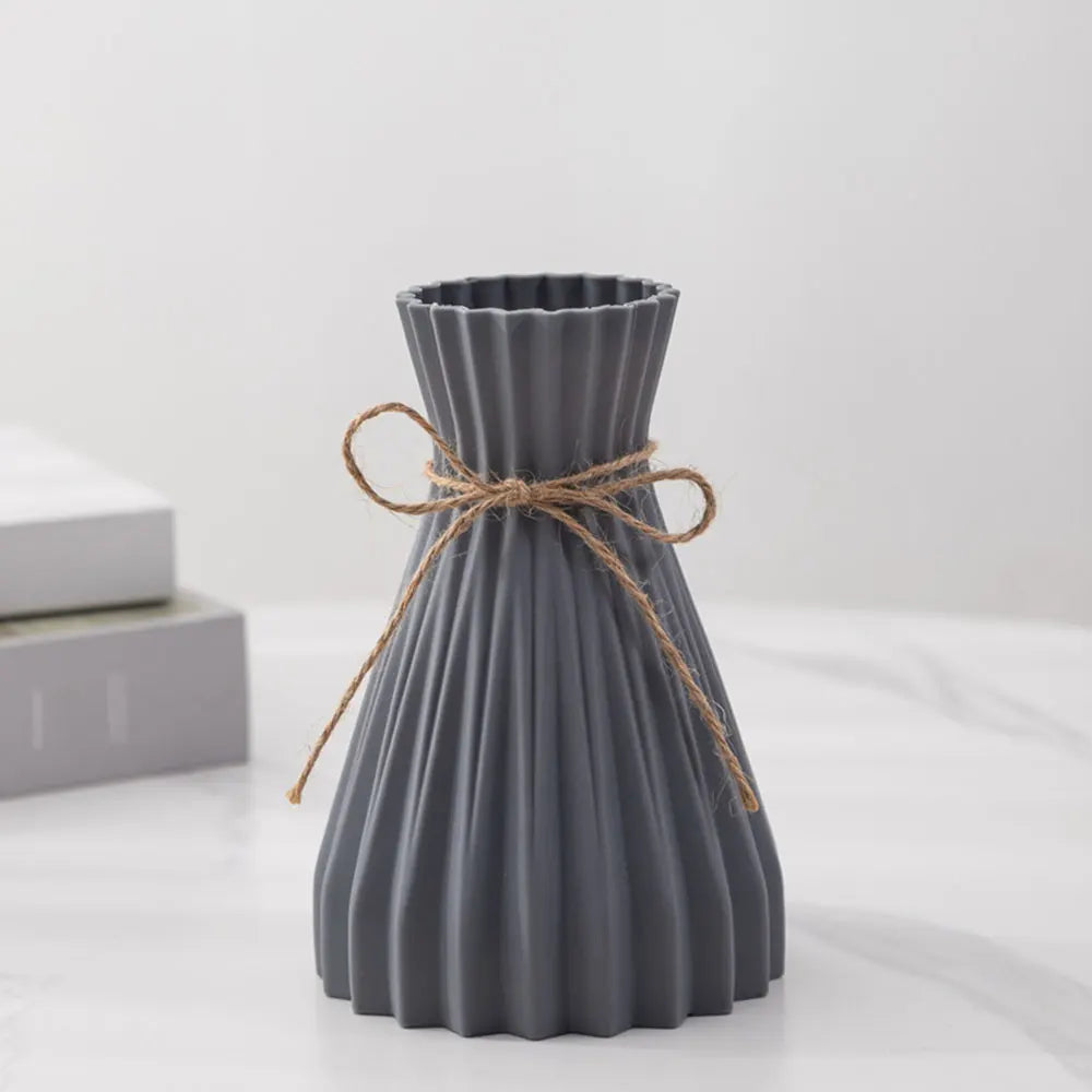 Gray pleated ceramic flower bottle with rustic twine bow designed as a modern dry flower bottle type