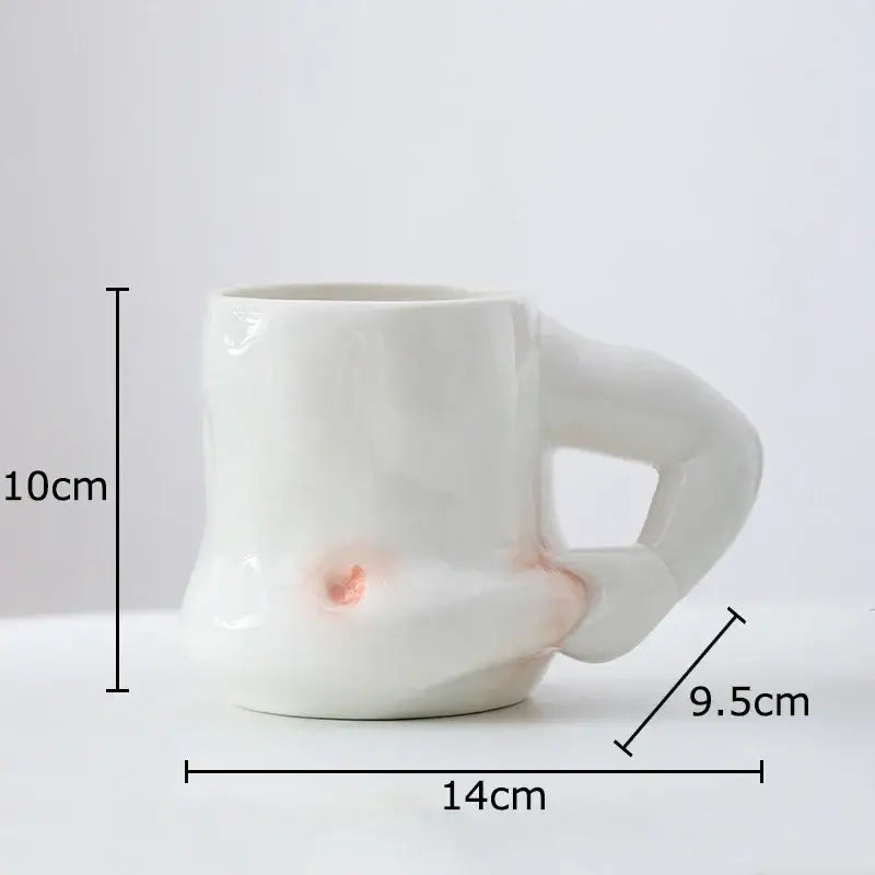 White ceramic creative pinch belly mug with sculpted organic hand handle and subtle pink glaze decorbites creative pinch