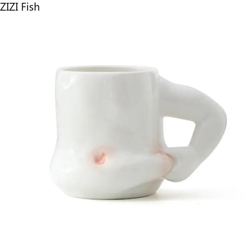 White ceramic creative pinch belly cup with sculpted abstract handle and pinkish glaze accents for dining room use