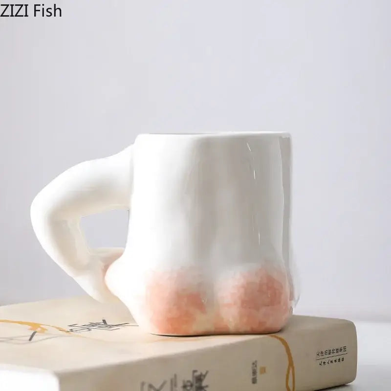White ceramic creative pinch belly mug with sculpted hand handle and peach gradient base for dining room decorbites creative pinch