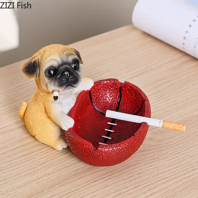A charming tan and black basketball puppy ashtray featuring a yellow pug figurine with cigarette and red basketball design