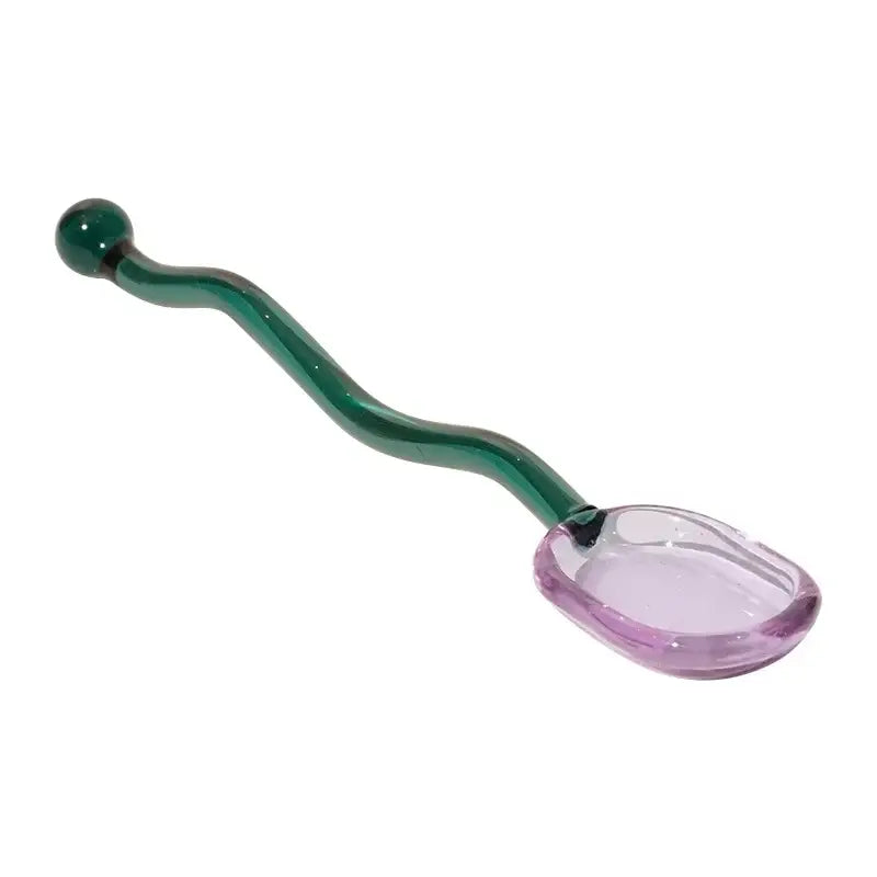Creative purple and green glass spoon dessert set with a translucent purple bowl and curved emerald green handle