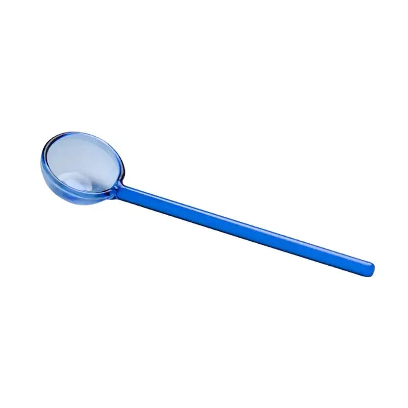 Blue plastic ladle with rounded transparent bowl and smooth handle in creative purple and green glass spoon dessert set for ice cream