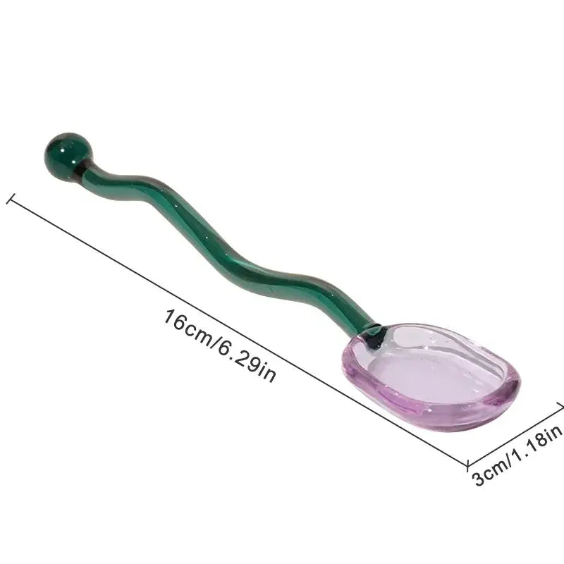 Creative purple and green glass spoon dessert set featuring a translucent purple bowl and curved emerald green handle