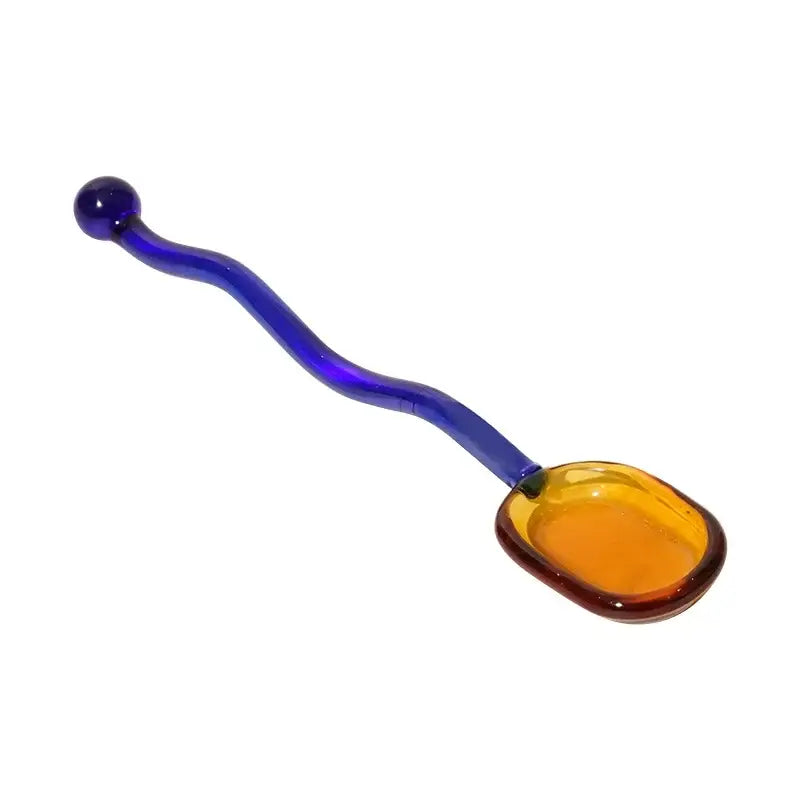 Creative glass spoon dessert with a wavy cobalt blue handle and amber bowl from purple and green set for ice cream dining