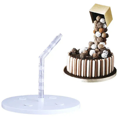 A clear acrylic cake stand with white circular base and curved red and white cake stand support for kitchen baking