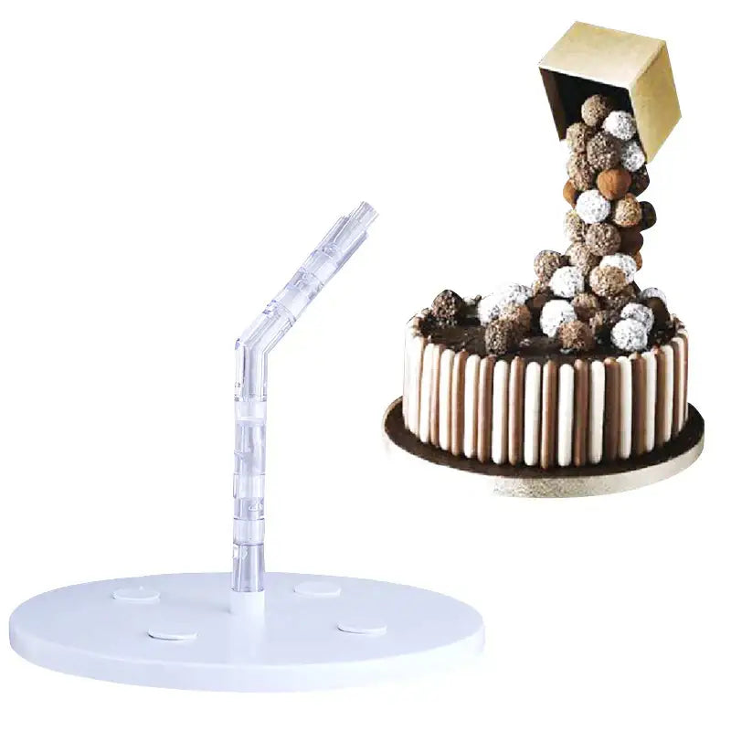 A clear acrylic cake stand with white circular base and curved red and white cake stand support for kitchen baking