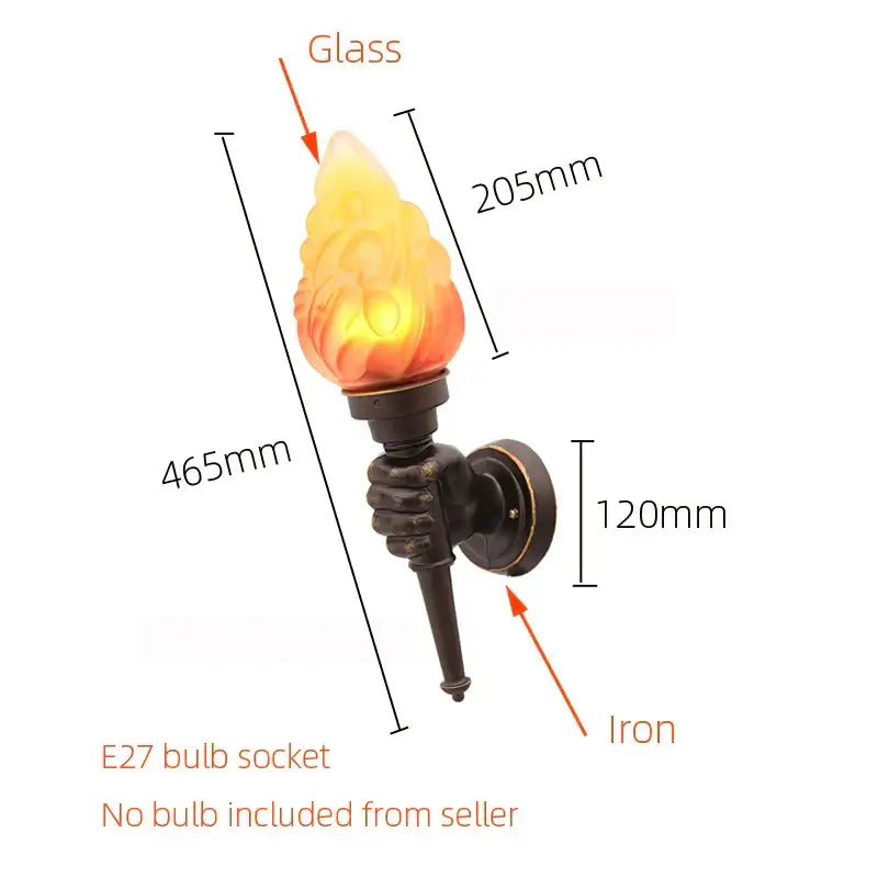 A creative torch hand wall lamp with warm glowing bronze glass held by a dark iron hand for living room decorbites
