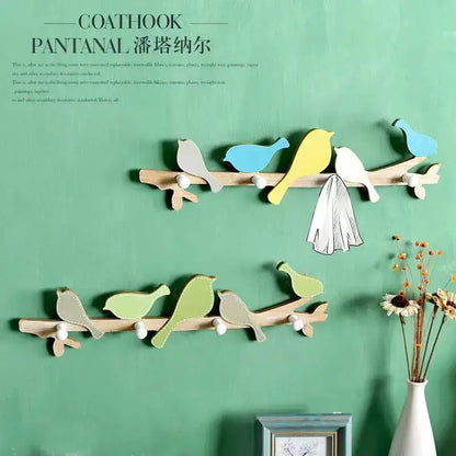 Wooden birds coat rack with colorful painted birds and white spherical hooks for entryway decorbites coat rack