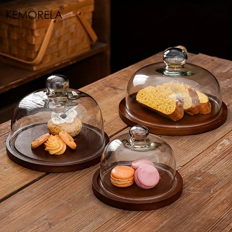 Creative wooden cake storage box features clear glass domes with silver knobs on dark wooden bases for elegant display