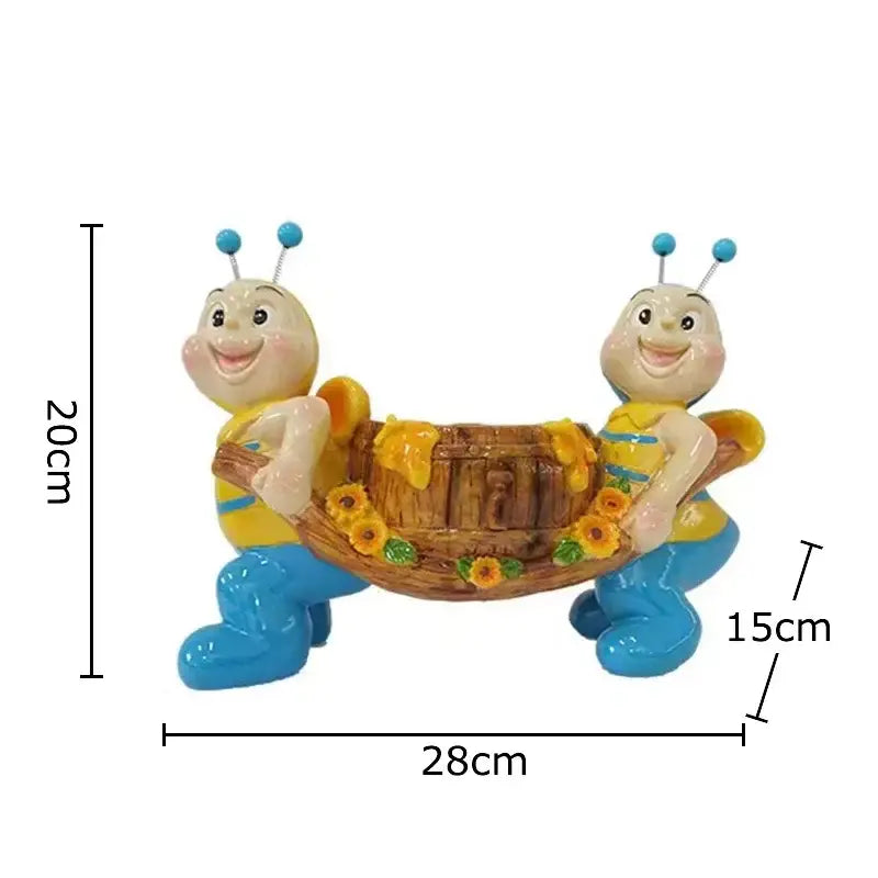 Creative yellow and black bee resin vase featuring cute resin bees with blue antennae carrying sunflower barrel decor