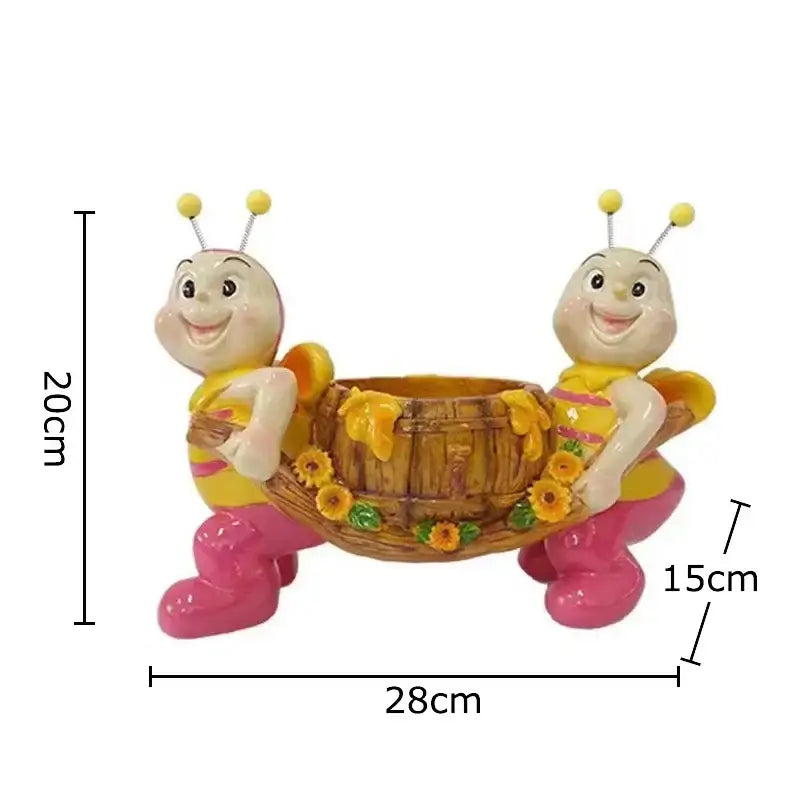 Creative yellow and black bee resin vase with two smiling bees carrying a sunflower-adorned wooden barrel planter