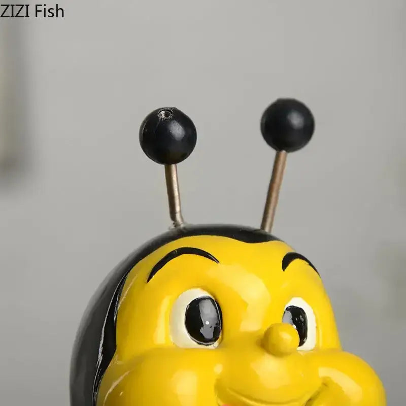 Creative yellow and black bee resin vase with glossy finish and round black antennae for living room plants