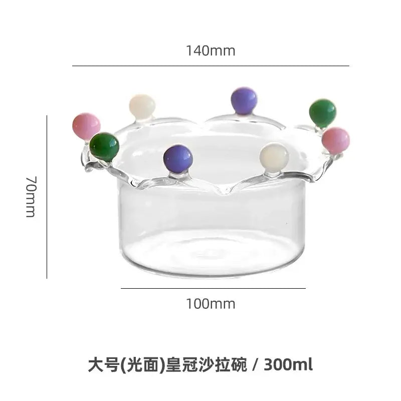 Clear glass fruit bowl with crown shaped rim featuring colorful glossy beads by decorbites for dining room decor