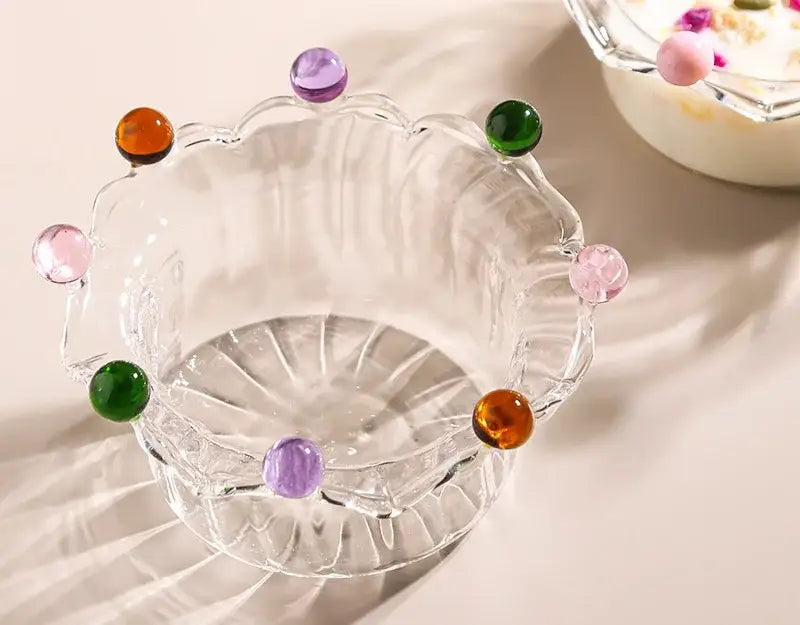 Clear glass fruit bowl with scalloped edge and colorful translucent gemstone accents by decorbites clear glass