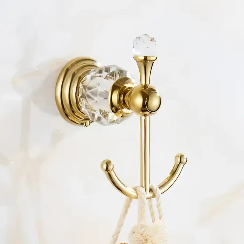 Gold-colored bathroom hook with crystal accents and decorative top knob from decorbites brass crystal bathroom accessories set