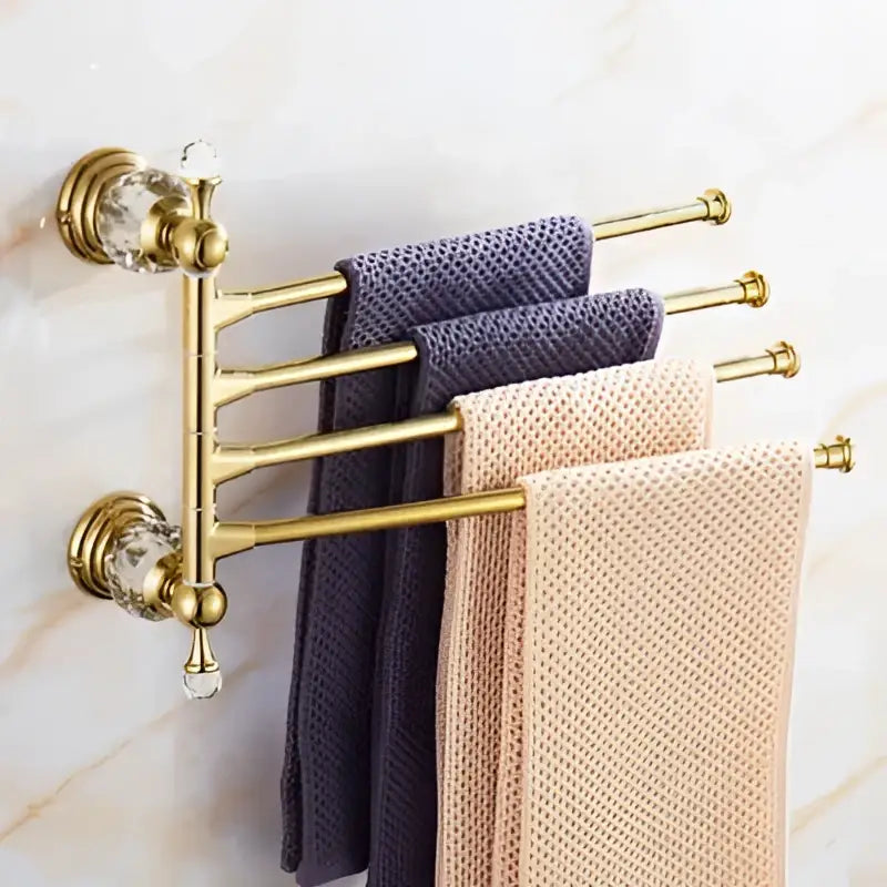 Gold crystal bathroom accessories towel rack with crystal accents holding purple and beige towels decorbites brass set