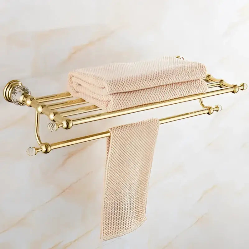 Gold-toned crystal bathroom accessories towel rack with crystal accents and beige towels decorbites brass set