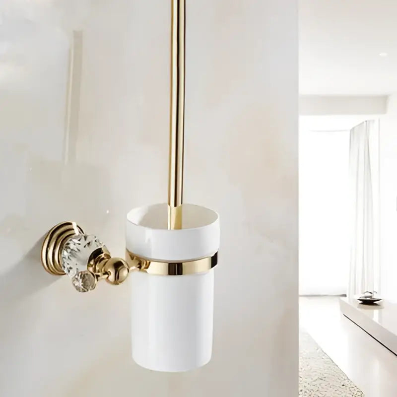 White ceramic toilet brush holder with gold brass accents and crystal knob wall mounted from decorbites bathroom accessories set