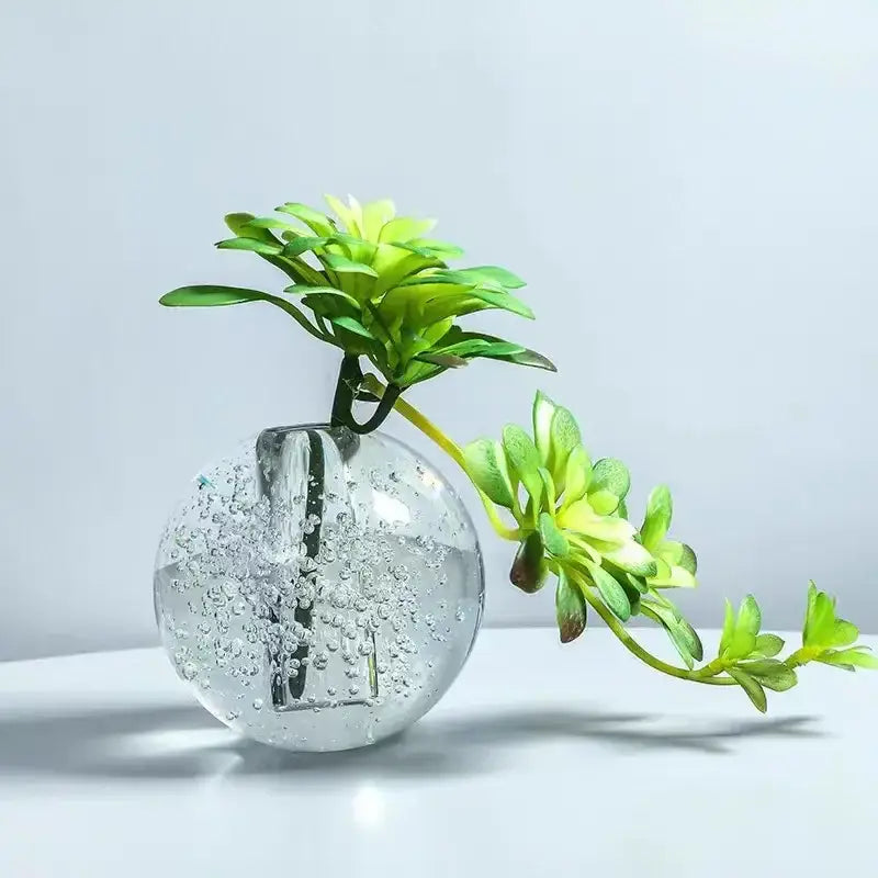 Clear spherical glass crystal bubble ball vase with green succulent and yellow artificial flowers for desk decorbites decor