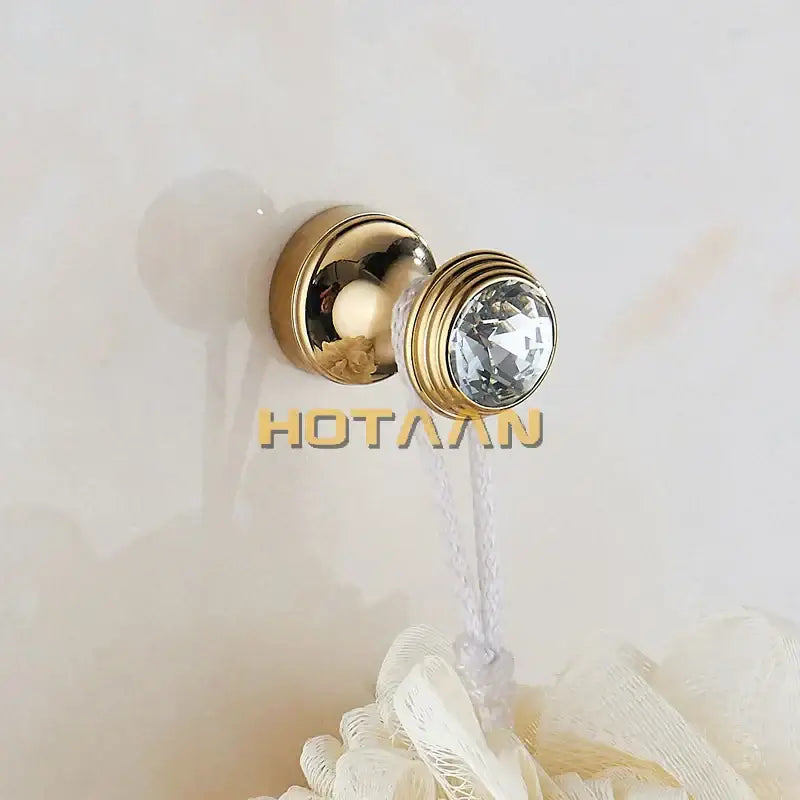 Gold-toned wall hook with faceted crystal accent and ribbed design from decorbites crystal chrome wall hook set