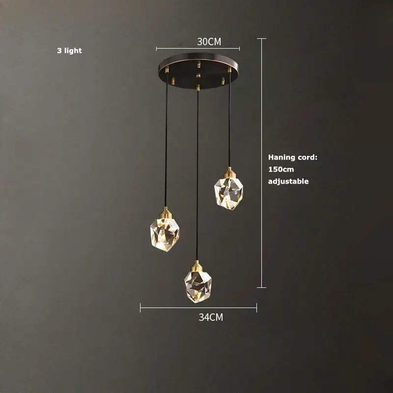 Modern crystal copper chandelier with three faceted crystal globes and brass accents for gold and black dining room decorbites crystal copper