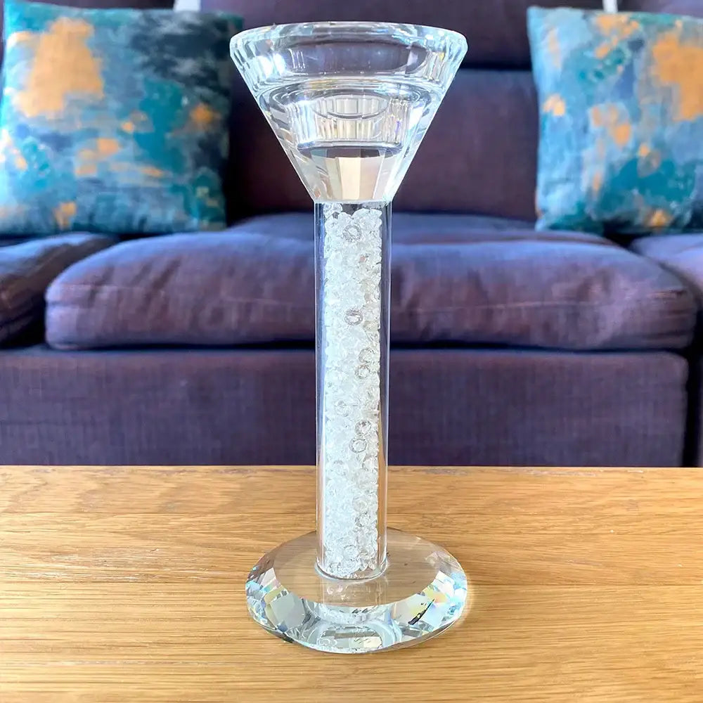 Clear glass decorbites crystal diamond candle holder with fluted top, slender stem with white bead inlay, and faceted base