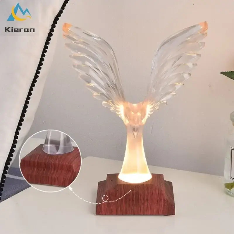 Crystal eagle led table lamp with clear illuminated wings resting on a dark wood base for bedroom decorbites crystal eagle