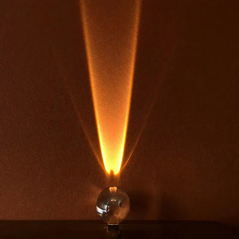 A decorbites crystal eye sky led table lamp with a transparent crystal sphere emitting warm amber light beam decorbites table lamp