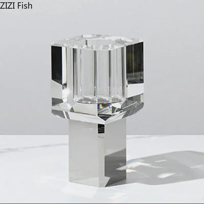 Crystal fish clear glass vase with a faceted clear crystal candle holder and sleek metallic base for living room decor