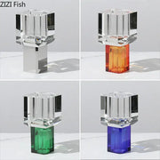 Crystal clear glass fish-shaped vase with metallic base and orange green and blue accents for living room decor