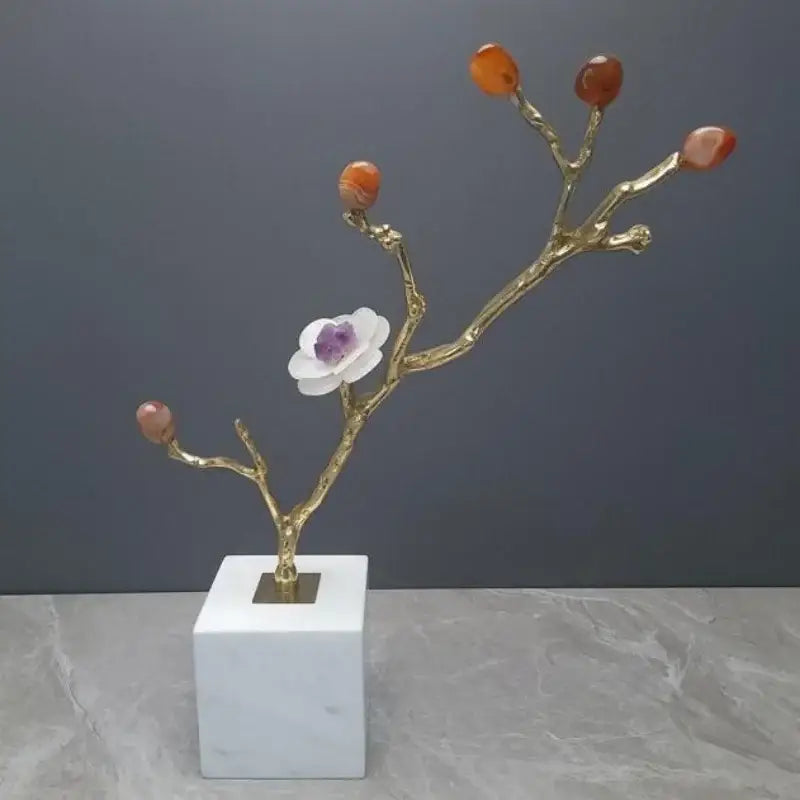 Crystal flower tree sculpture with golden branches, polished orange agate buds, white flower with purple center on marble base