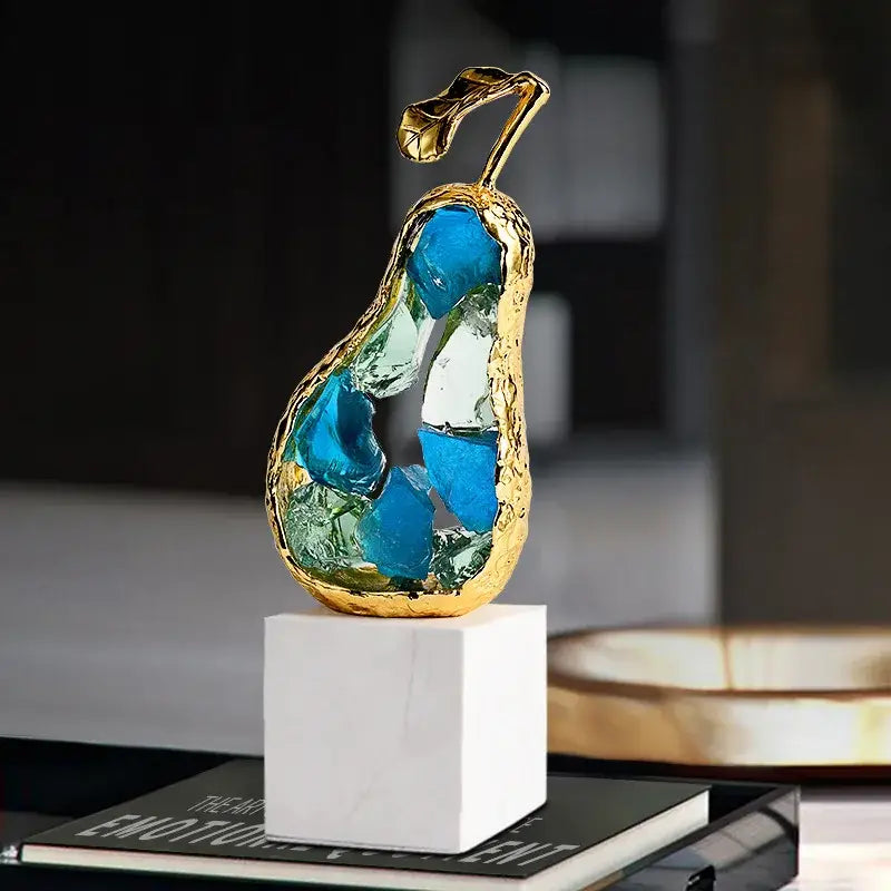 Decorbites crystal fruit gold-toned glass pear sculpture with blue and green inlays on white marble base for living room decor