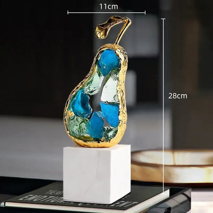 Gold-framed crystal fruit sculpture with blue and green glass shards on white marble base for living room decorbites crystal fruit