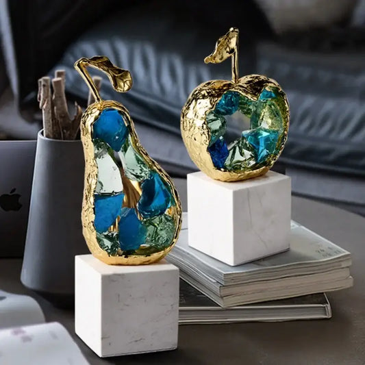 Golden pear and apple crystal fruit sculpture set with blue and green glass inlays on white marble base for decorbites crystal fruit