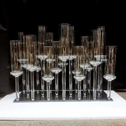 Crystal glass candle holders with teardrop accents and slender stems in a modern geometric dining room display decorbites crystal glass