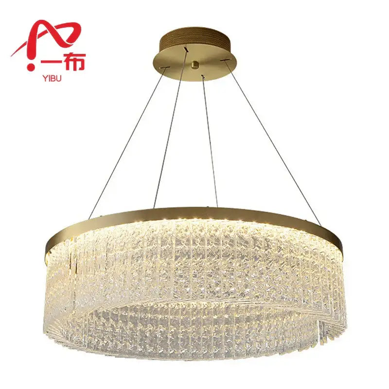 Gold-toned crystal glass gold pendant chandelier with cascading tiers emitting warm glow for dining room decorbites