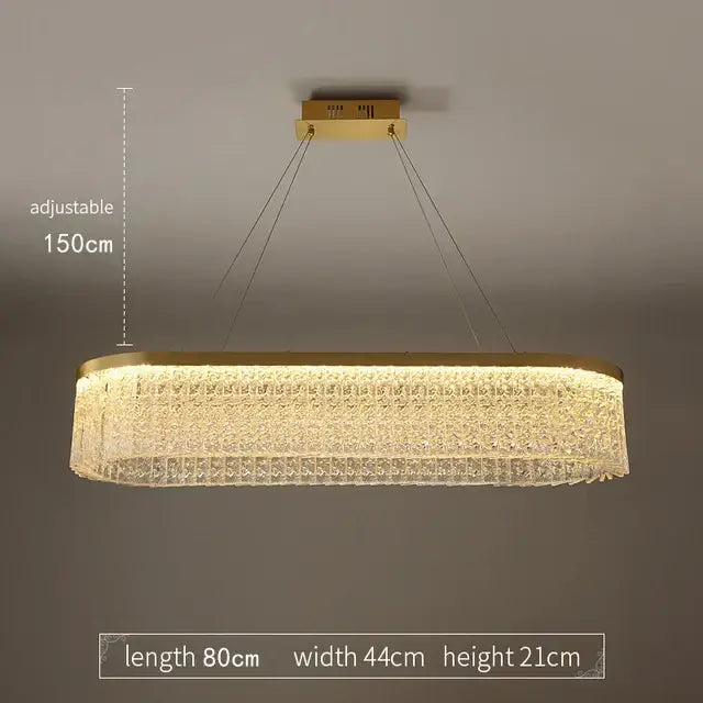 Gold-toned rectangular decorbites crystal glass pendant chandelier with textured crystal body and adjustable hanging chains