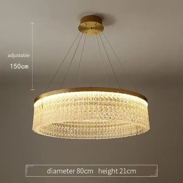 Gold-toned circular glass gold pendant chandelier with cascading crystal tiers and adjustable height for dining room decorbites crystal glass